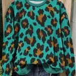 TURQUOISE ANIMAL PRINT PULLOVER