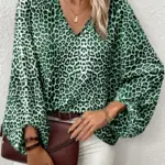 GREEN AND BLACK ANIMAL PRINT TOP WITH LANTERN SLEEVES